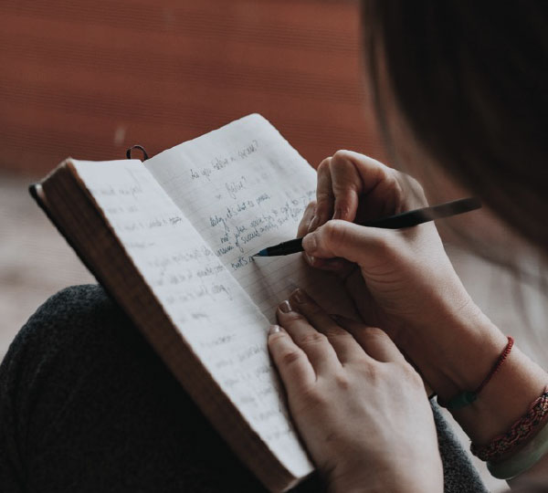 Setting-New Years Goals Post Divorce Image of Person Writing in Journal