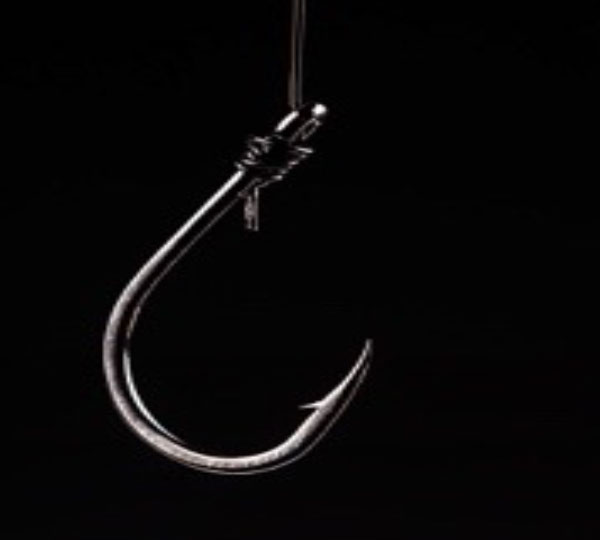 silver ish hook on string over black background